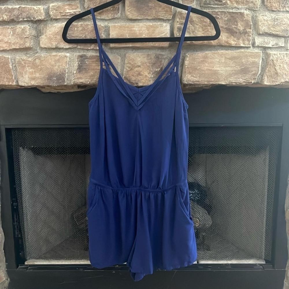 Express blue romper with pockets and adjustable straps. Size XS
